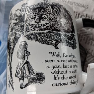 Alice in wonderland disappearing Cheshire cat mug.